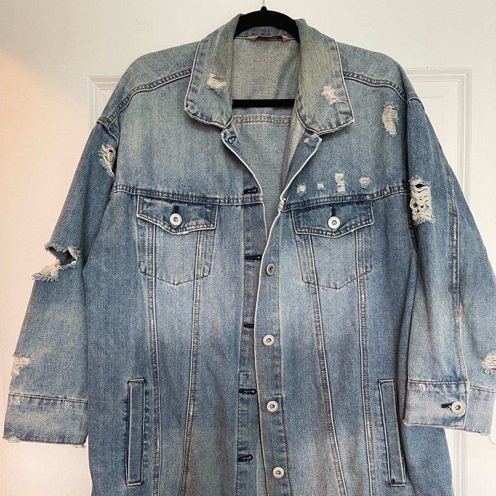 Fashion to figure. 3/4 inch sleeve distressed long line jean jacket.